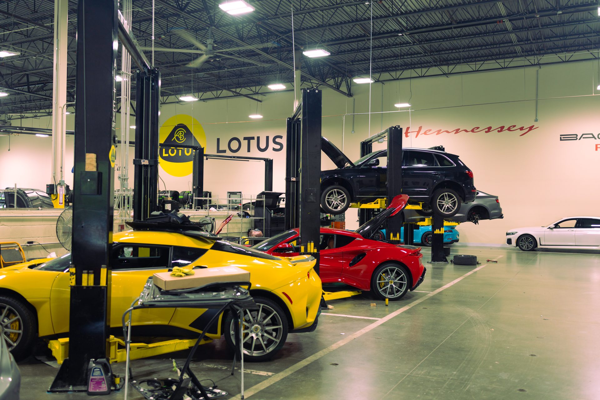 Earth MotorCars service bay with Lotus and Hennessey vehicles